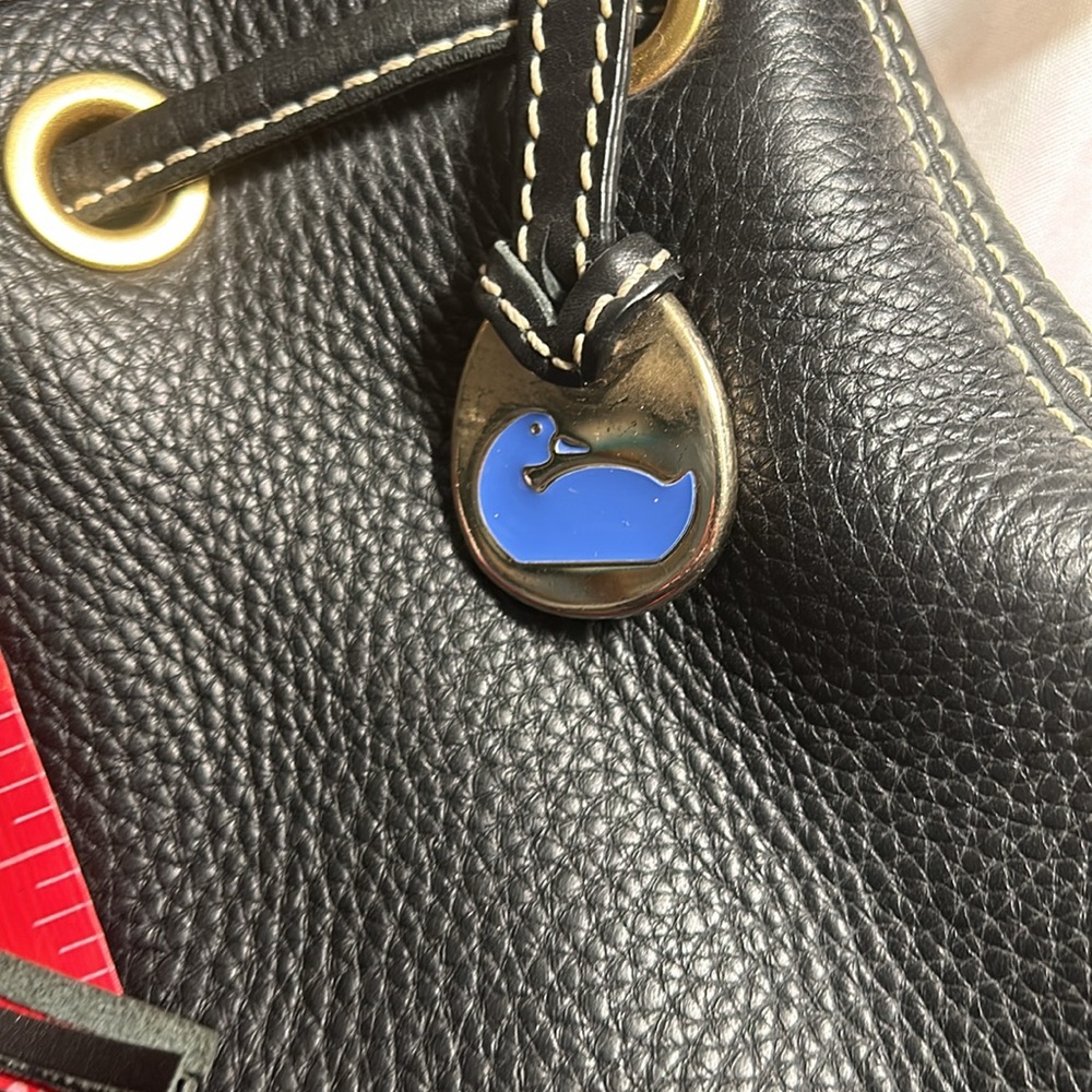 Dooney & Bourke Drawstring bag with tassels and duck tag. - Picture 8 of 12